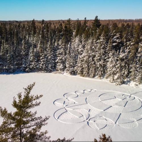 A design imprinted in the snow on a frozen lake