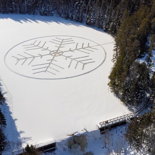 Giant snowflake design imprinted on the Mill Creek Nature Park reservoir.