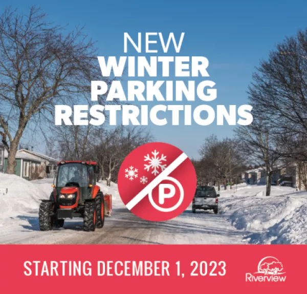 Snowplow on street to announce new winter parking restrictions