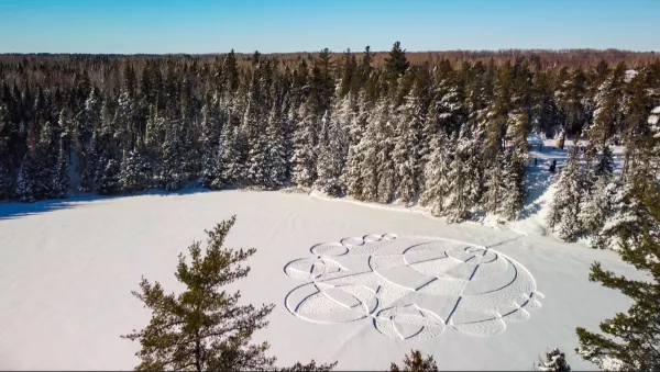 A design imprinted in the snow on a frozen lake