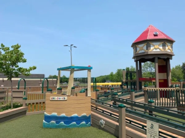 A park playground structure on a sunny day