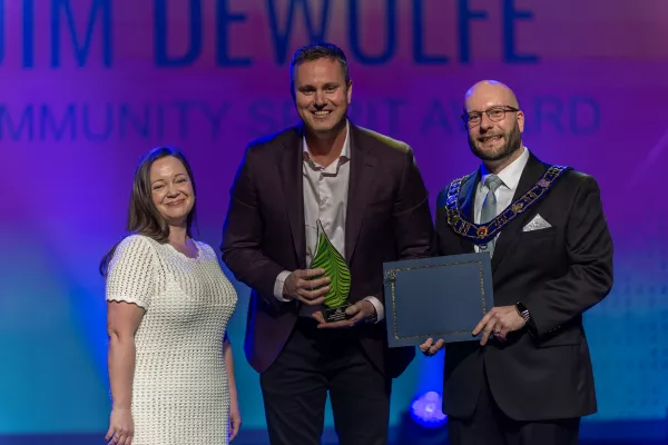 committee chair, Melannie Eldridge stands beside 2024 recipient, Robert Taylor and Mayor Andrew J. LeBlanc