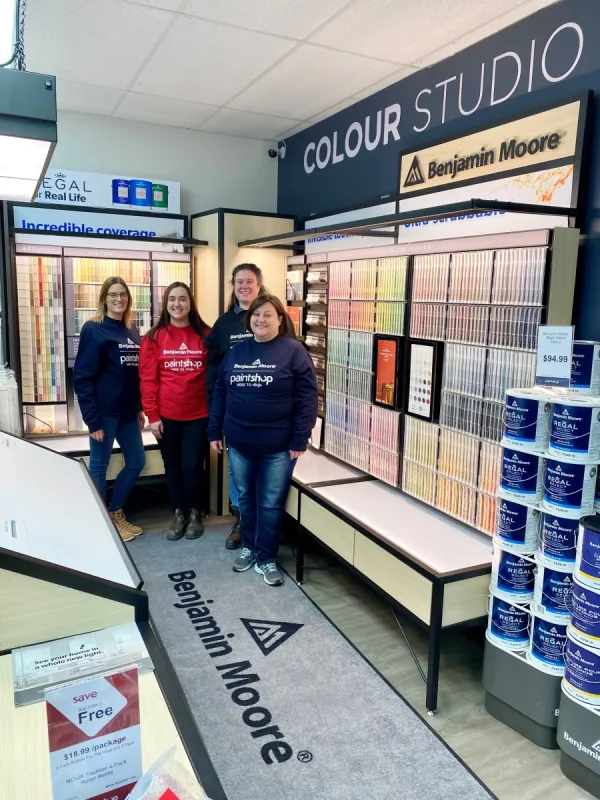 The staff of Benjamin Moore Pain Shop standing inside of the store