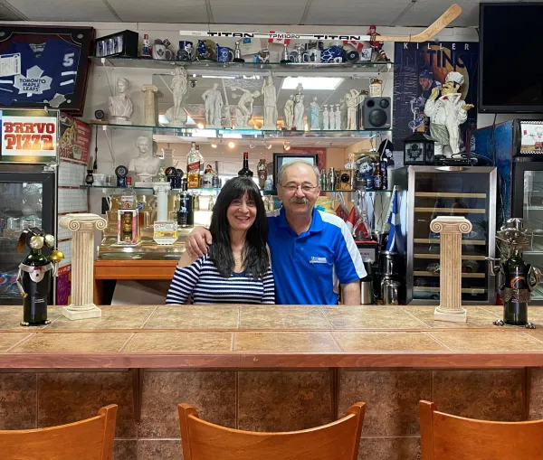 Mike and his wife, Eleni, behind the bar at Bravo Pizza