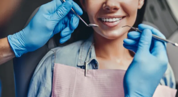 Dental hygienist and client 