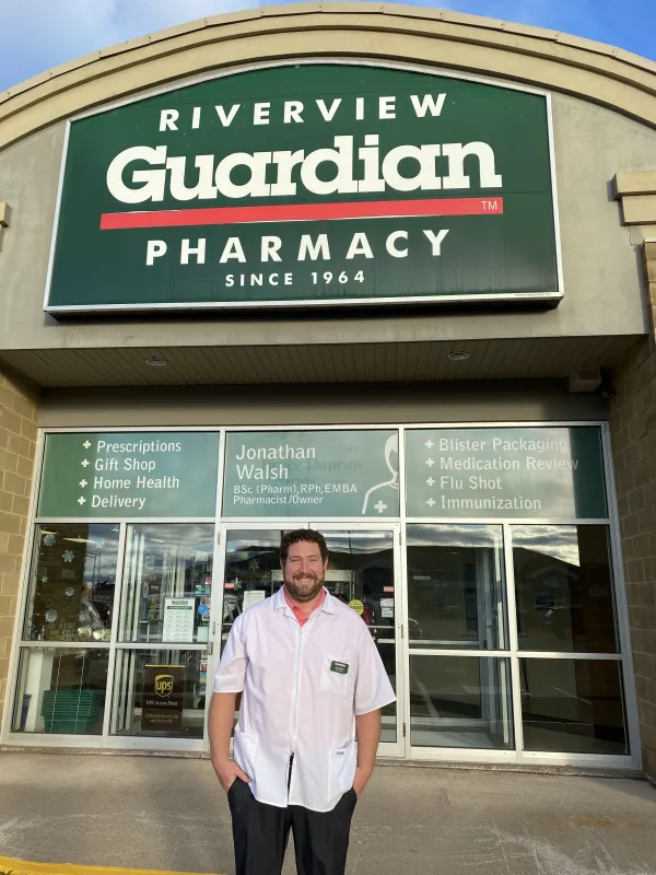 Owner stands outside of the pharmacy