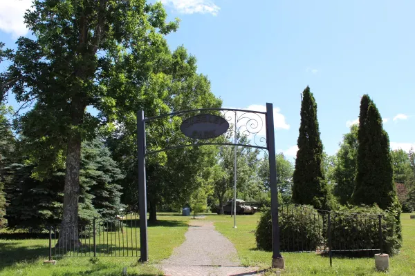 A picture of the entrance to Caseley park with sign and trees