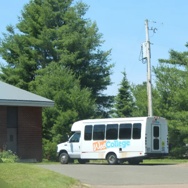 The Wee College van with logo outside the White Pine Campus