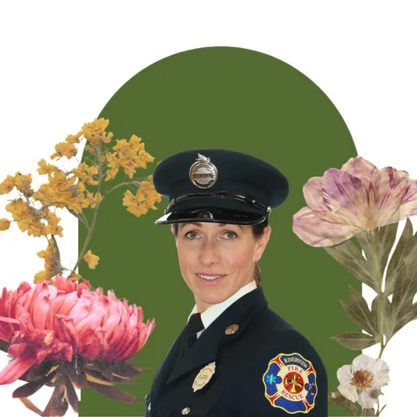 Female firefighter with a floral and green backdrop