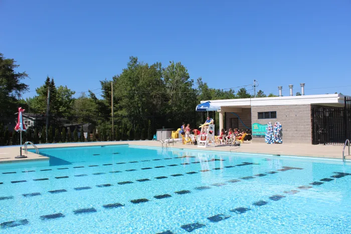 An outdoor community pool on a sunny day