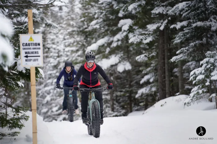 2 fat bikers on a snowy trail. Photo credit to Andre Boulard