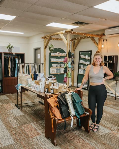 Emma standing inside her business