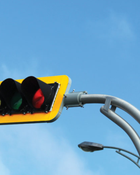 traffic light against a blue sky