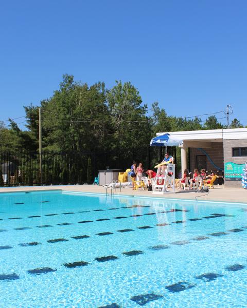 An outdoor community pool on a sunny day